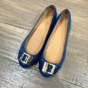 CK Navy blue flats with gold buckle